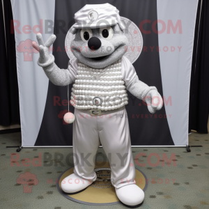Silver Golf Ball mascot costume character dressed with a Dress Pants and Necklaces