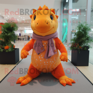 Orange Ankylosaurus mascot costume character dressed with a Yoga Pants and Scarves