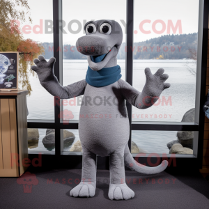 Gray Loch Ness Monster mascot costume character dressed with a Skinny Jeans and Mittens
