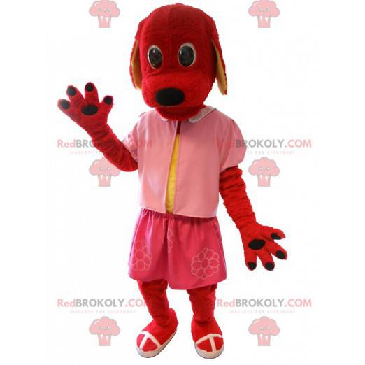 Rotes Hundemaskottchen gekleidet in Rosa. Hundekostüm -