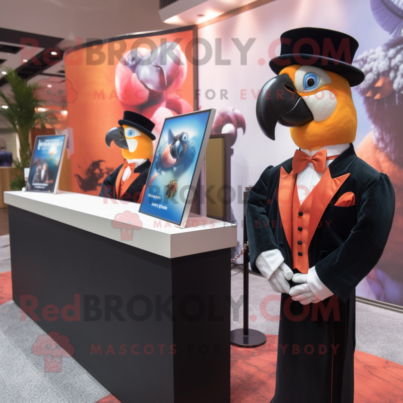 Peach Macaw mascot costume character dressed with a Tuxedo and Watches Peach Macaw mascot costume character dressed with a Tuxedo and Watches