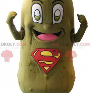 Mascotte de cornichon vert avec le logo SuperMan sur le ventre