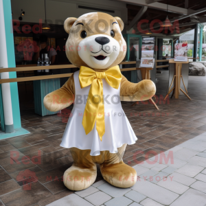 Gold Otter mascot costume character dressed with a A-Line Skirt and Bow ties