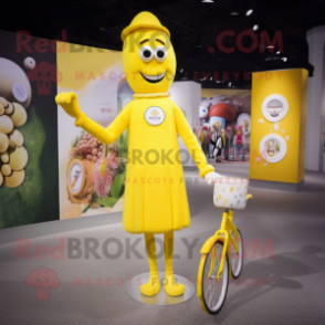 Yellow Unicyclist mascot costume character dressed with a Shift Dress and Keychains