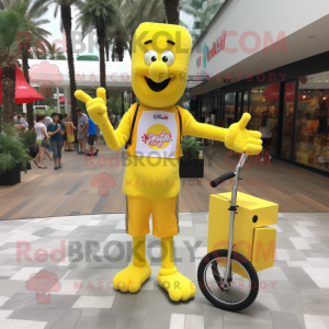 Yellow Unicyclist mascot costume character dressed with a Shift Dress and Keychains