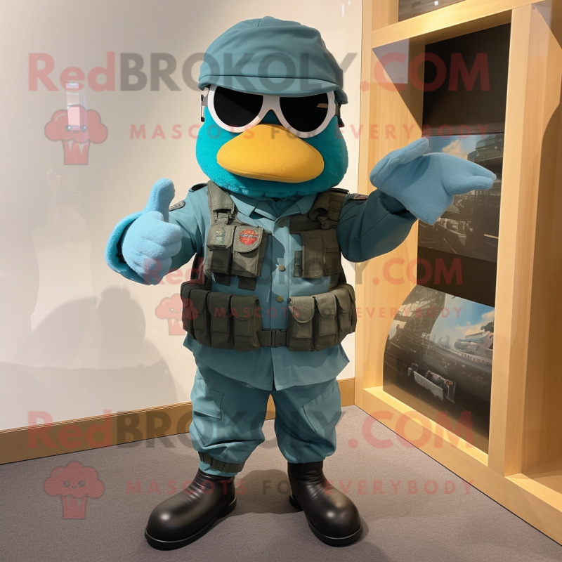 Teal Para Commando mascot costume character dressed with a Romper and Caps Teal Para Commando mascot costume character dressed with a Romper and Caps