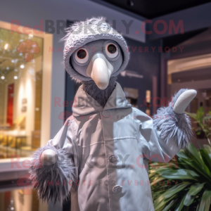 Silver Ostrich mascot costume character dressed with a Raincoat and Beanies