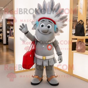 Gray Chief mascot costume character dressed with a Flare Jeans and Handbags