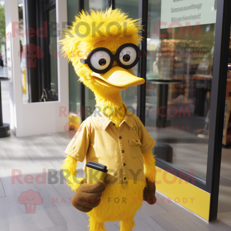 Yellow Ostrich mascot costume character dressed with a Henley Shirt and Eyeglasses