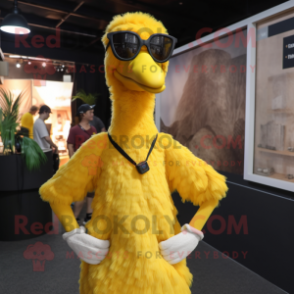 Yellow Ostrich mascot costume character dressed with a Henley Shirt and Eyeglasses