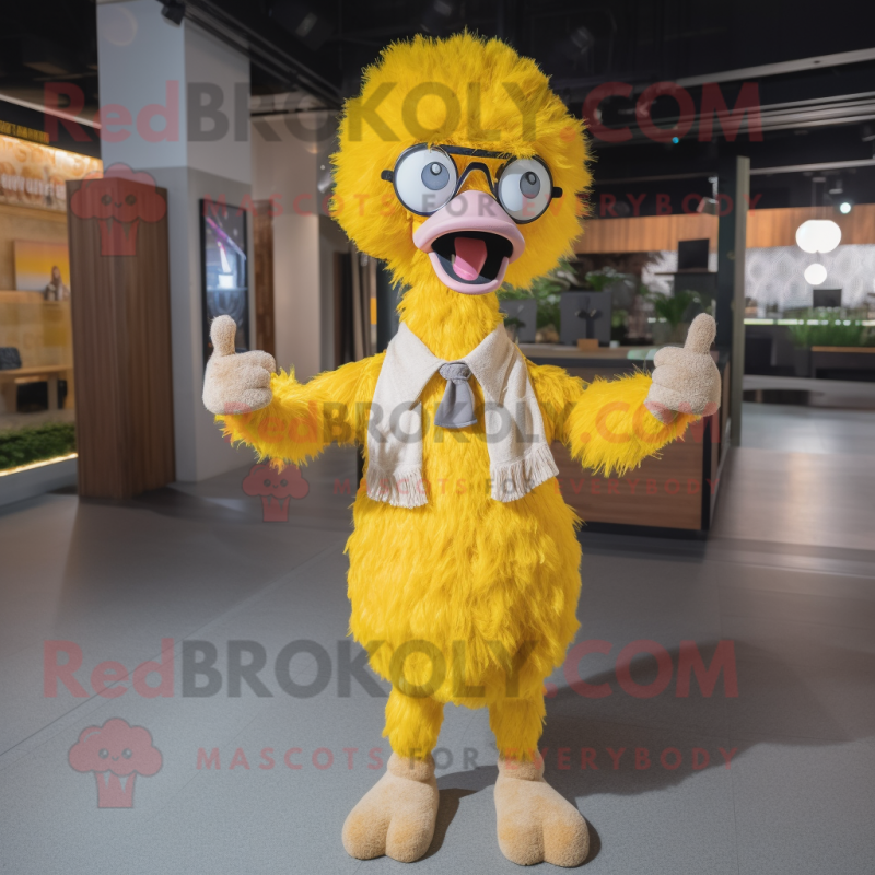 Yellow Ostrich mascot costume character dressed with a Henley Shirt and Eyeglasses Yellow Ostrich mascot costume character dressed with a Henley Shirt and Eyeglasses