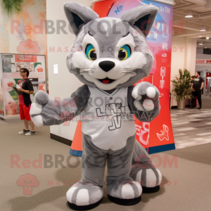 Gray Lynx mascot costume character dressed with a Bermuda Shorts and Hair clips