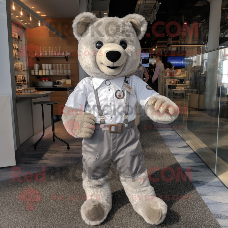 Silver Teddy Bear mascot costume character dressed with a Button-Up Shirt and Shoe clips Silver Teddy Bear mascot costume character dressed with a Button-Up Shirt and Shoe clips