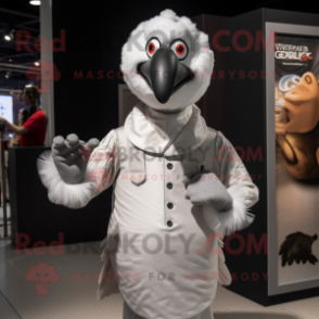 Silver Turkey mascot costume character dressed with a Poplin Shirt and Gloves