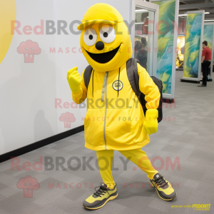 Yellow Grenade mascot costume character dressed with a Joggers and Shoe laces