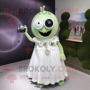 Olive Camera mascot costume character dressed with a Wedding Dress and Keychains