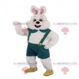 Mascot white rabbit with green overalls. Bunny costume -