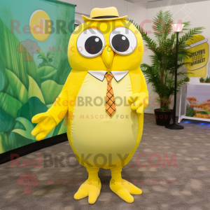 Lemon Yellow Owl mascot costume character dressed with a Bermuda Shorts and Tie pins