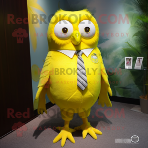 Lemon Yellow Owl mascot costume character dressed with a Bermuda Shorts and Tie pins