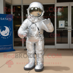 Silver Astronaut mascot costume character dressed with a Henley Shirt and Scarf clips