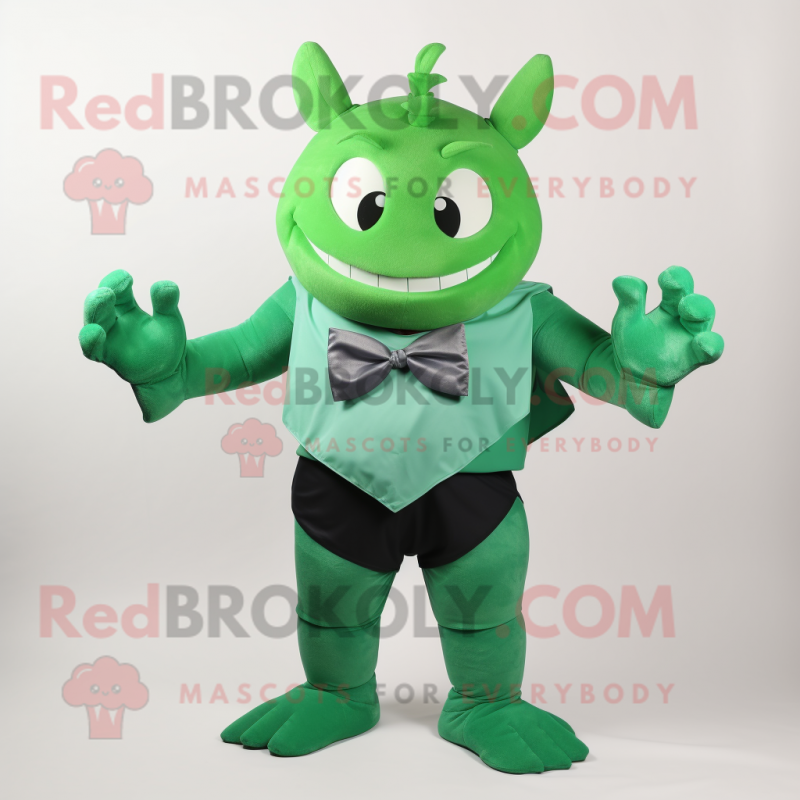 Green Devil mascot costume character dressed with a Tank Top and Bow ties Green Devil mascot costume character dressed with a Tank Top and Bow ties