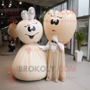 Beige Heart Shaped Balloons mascot costume character dressed with a Wedding Dress and Rings