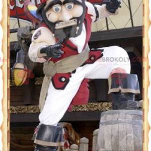 Mascotte de pirate en tenue blanche et rouge traditionnelle -