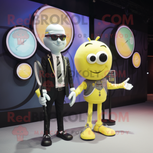 Yellow Tennis Racket mascot costume character dressed with a Suit Jacket and Smartwatches