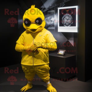 Gold Canary mascot costume character dressed with a Tank Top and Smartwatches