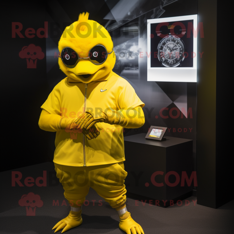 Gold Canary mascot costume character dressed with a Tank Top and Smartwatches Gold Canary mascot costume character dressed with a Tank Top and Smartwatches