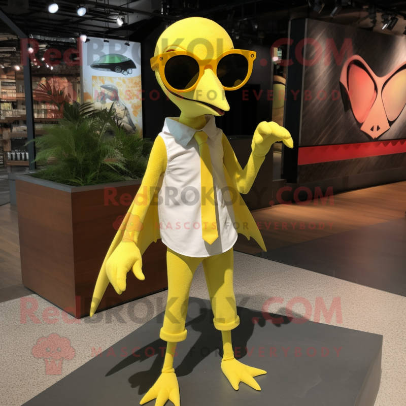 Lemon Yellow Pterodactyl mascot costume character dressed with a Henley Tee and Sunglasses Lemon Yellow Pterodactyl mascot costume character dressed with a Henley Tee and Sunglasses