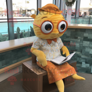 Tan Goldfish mascot costume character dressed with a Dress and Reading glasses