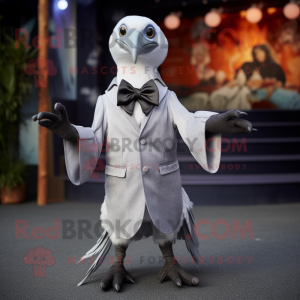 Silver Albatross mascot costume character dressed with a Coat and Bow ties