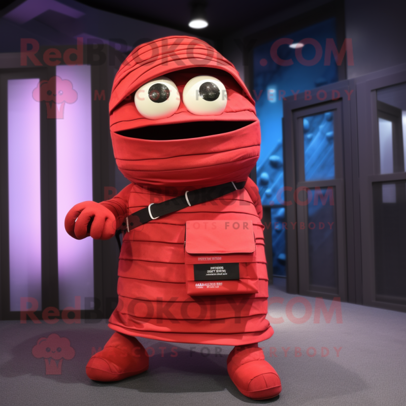 Red Mummy mascot costume character dressed with a Bermuda Shorts and Clutch bags Red Mummy mascot costume character dressed with a Bermuda Shorts and Clutch bags