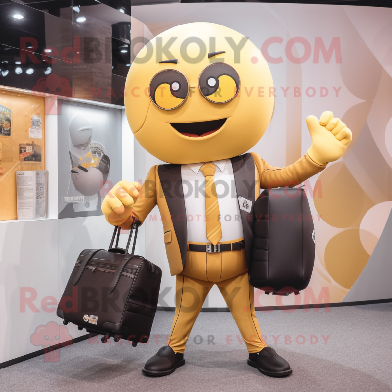 Gold Volleyball Ball mascot costume character dressed with a Suit and Briefcases Gold Volleyball Ball mascot costume character dressed with a Suit and Briefcases