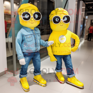 Lemon Yellow Pair Of Ice Skates mascot costume character dressed with a Chambray Shirt and Sunglasses