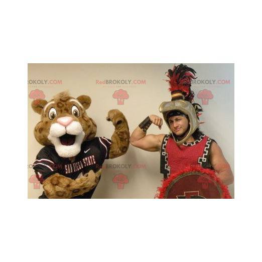 Braunes und weißes Tigermaskottchen in der Sportbekleidung -