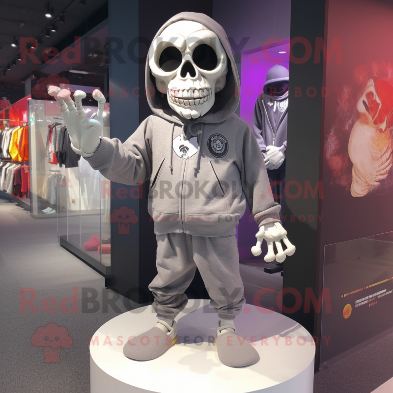 nan Skull mascot costume character dressed with a Sweatshirt and Shoe clips