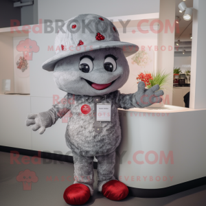 Silver Raspberry mascot costume character dressed with a T-Shirt and Hat pins