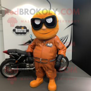 Rust Mango mascot costume character dressed with a Biker Jacket and Reading glasses