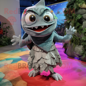 Silver Piranha mascot costume character dressed with a Wrap Skirt and Mittens