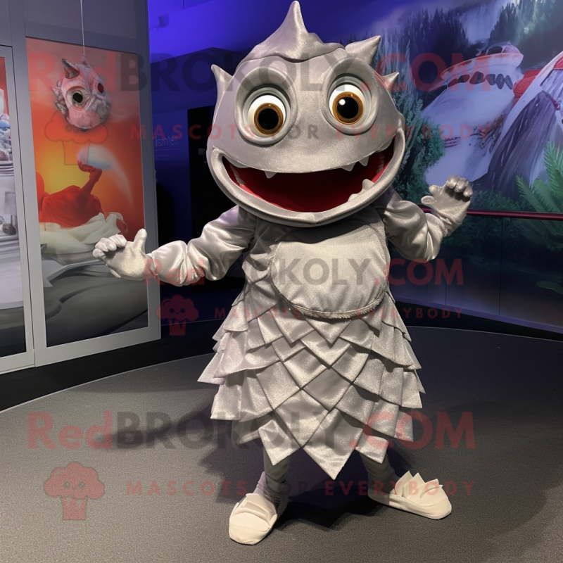 Silver Piranha mascot costume character dressed with a Wrap Skirt and Mittens