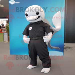 Black Beluga Whale mascot costume character dressed with a Polo Shirt and Belts