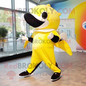 Lemon Yellow Killer Whale mascot costume character dressed with a Playsuit and Hairpins