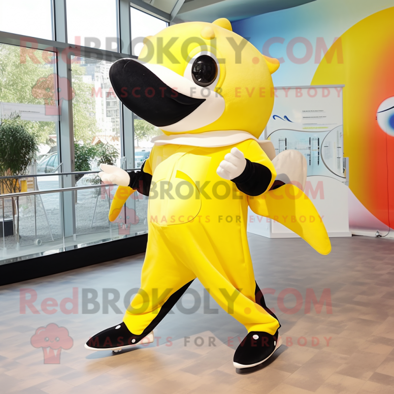 Lemon Yellow Killer Whale mascot costume character dressed with a Playsuit and Hairpins