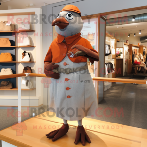 Rust Pigeon mascot costume character dressed with a A-Line Dress and Cufflinks