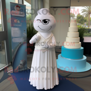 White Wedding Cake mascot costume character dressed with a Shift Dress and Shawl pins