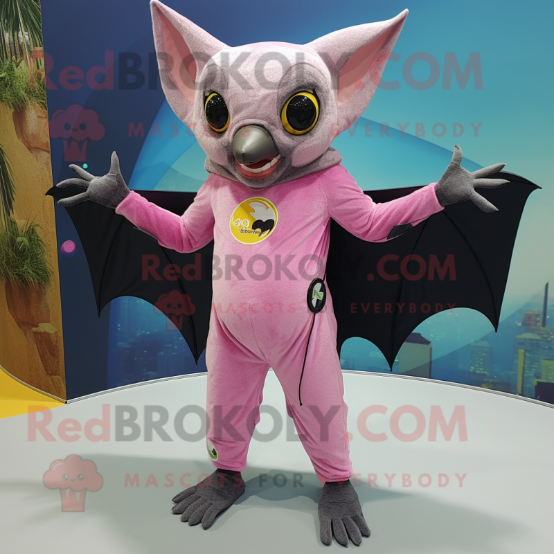 Pink Fruit Bat mascot costume character dressed with a Jeggings and Rings Pink Fruit Bat mascot costume character dressed with a Jeggings and Rings