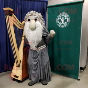 Gray Celtic Harp mascot costume character dressed with a Dress Shirt and Shawl pins