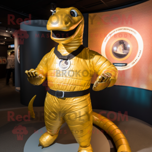 Gold Titanoboa mascot costume character dressed with a Rash Guard and Rings